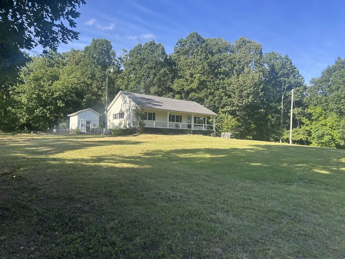 Freshly mowed acreage and yard around a North Alabama home by Dustline Property Services