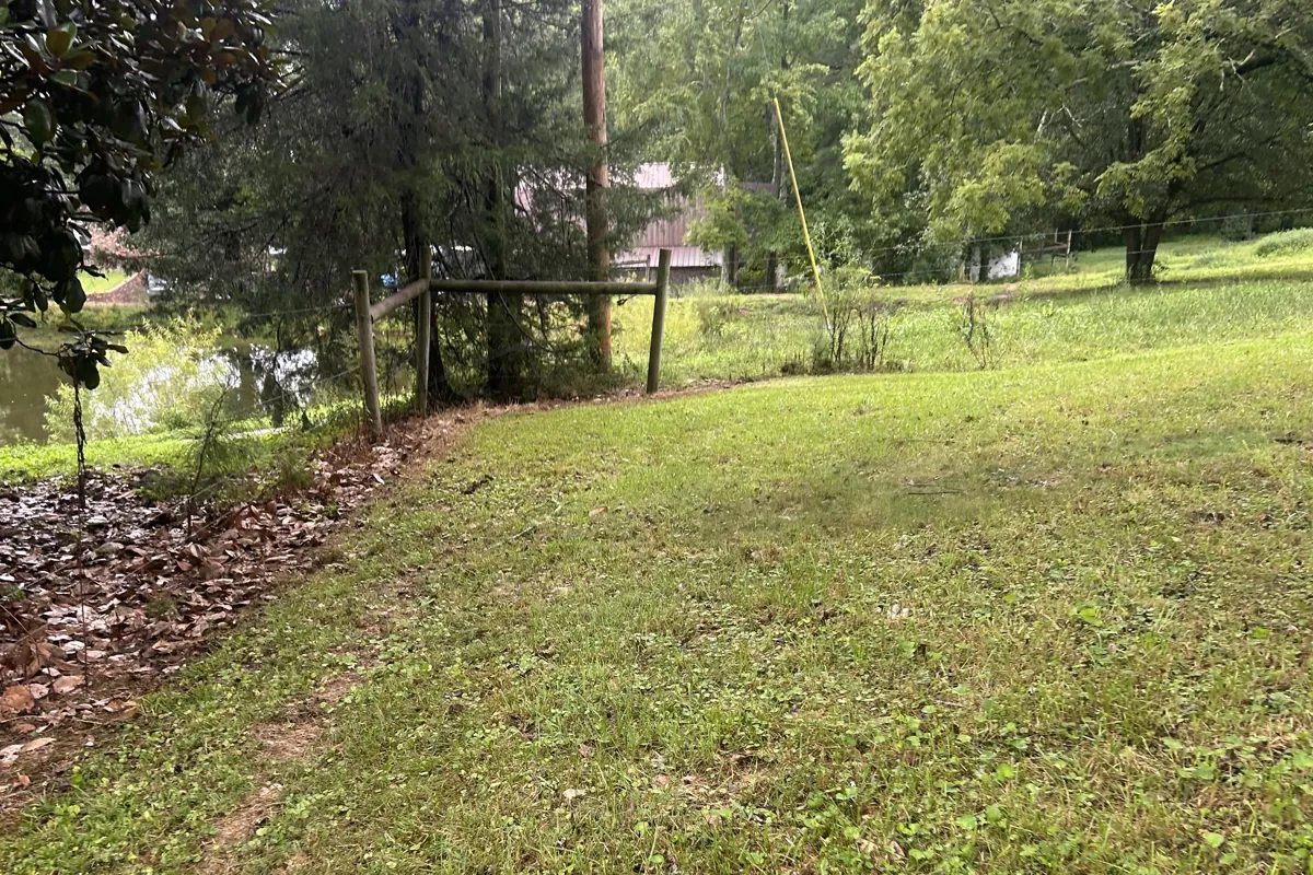 The same Fort Payne, AL ditch bank cleared and mowed clean after Dustline property cleanup